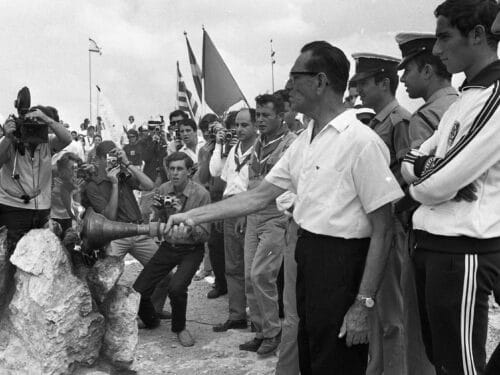 Yosef Yekutieli lighteng the torch of the eighth Maccabiah Games in 1969 (Wikimedia Commons)