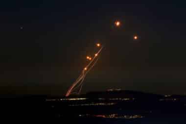 Rockets fired from southern Lebanon are intercepted by Israel's Iron Dome air defence system over the Upper Galilee region in northern Israel on September 27, 2024.