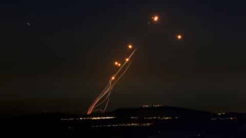 Rockets fired from southern Lebanon are intercepted by Israel's Iron Dome air defence system over the Upper Galilee region in northern Israel on September 27, 2024.