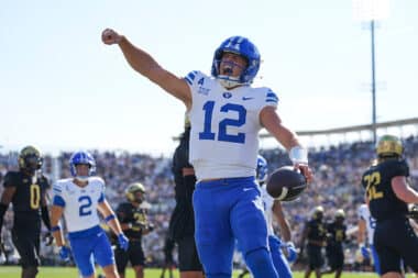 ORLANDO, FL - OCTOBER 26: Brigham Young Cougars quarterback Jake Retzlaff (12) celebrates after his rushing touchdown in the first half during the game between the BYU Cougars and the UCF Knights on Saturday, October 26, 2024 at FBC Mortgage Stadium in Orlando, Fla. (Photo by Peter Joneleit/Icon Sportswire via Getty Images)