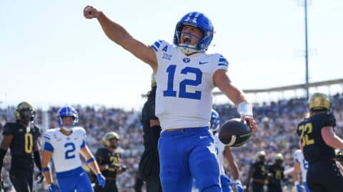 ORLANDO, FL - OCTOBER 26: Brigham Young Cougars quarterback Jake Retzlaff (12) celebrates after his rushing touchdown in the first half during the game between the BYU Cougars and the UCF Knights on Saturday, October 26, 2024 at FBC Mortgage Stadium in Orlando, Fla. (Photo by Peter Joneleit/Icon Sportswire via Getty Images)