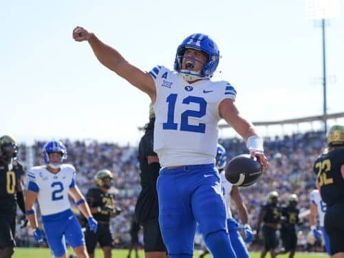 ORLANDO, FL - OCTOBER 26: Brigham Young Cougars quarterback Jake Retzlaff (12) celebrates after his rushing touchdown in the first half during the game between the BYU Cougars and the UCF Knights on Saturday, October 26, 2024 at FBC Mortgage Stadium in Orlando, Fla. (Photo by Peter Joneleit/Icon Sportswire via Getty Images)