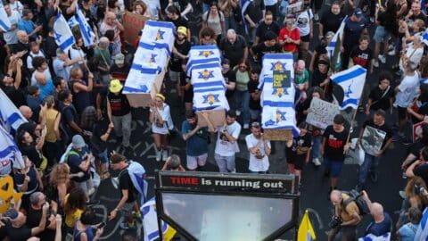 Protesters carry symbolic coffins during an anti-government rally calling for the release of Israelis held hostage by Hamas in Gaza since October, in Tel Aviv on September 1, 2024.