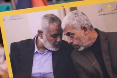 A banner with a photo of former Hamas leader Ismail Haniyeh, who was assassinated in Tehran in July, (left) and Hamas leader Yahya Sinwar (right), who was eliminated in Gaza in October, held by protesters protesting Sinwar's elimination in Tunis, Tunisia.