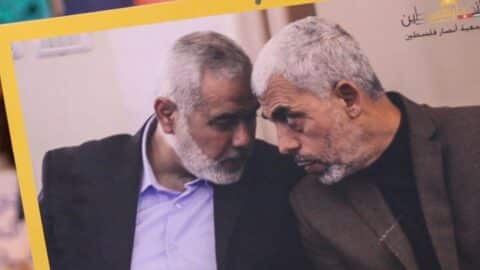 A banner with a photo of former Hamas leader Ismail Haniyeh, who was assassinated in Tehran in July, (left) and Hamas leader Yahya Sinwar (right), who was eliminated in Gaza in October, held by protesters protesting Sinwar's elimination in Tunis, Tunisia.