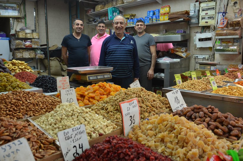 Moshe and his children run the Moshe and Sons store at Levinsky Market, where they sell nuts and dried fruit./Erez Kaganovitz